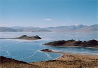 The saddle-shaped island of Dotaga (do rta sga) in jewel-like Darok Tso (da rog mtsho). The big and small headlands of Lemar Jang (sle dmar byang) are in the foreground.